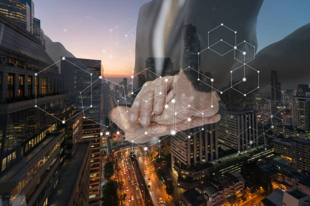 istock Group businessmen join hands for working. symbolizing the hands to unity and teamwork. in the background of bangkok city,  Double exposure 956247228