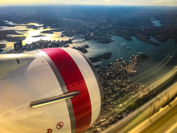 View over Sydney from a jet aeroplane flying at sunset