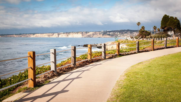 Long concrete path walkway along coastline in La Jolla Cove California stock photo