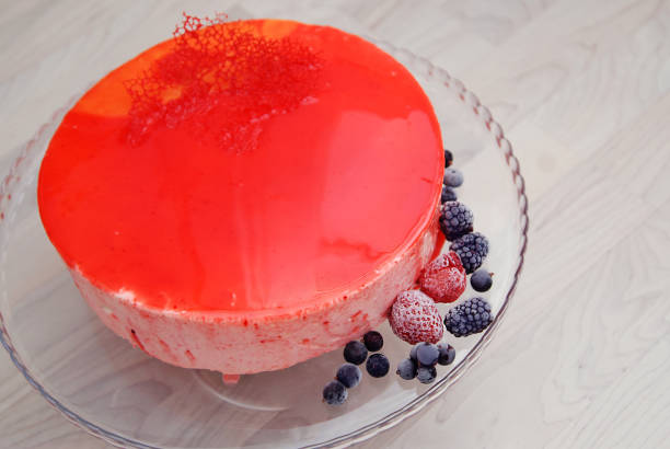 Red Mirror Glazed Fruit Mousse Cake without Decoration. Top view. Iced Berries. Step by Step Cooking Process.