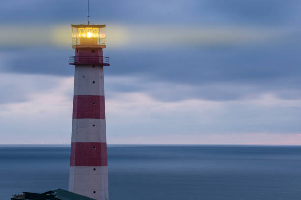 istock Lighthouse searchlight beam through marine air 956272704