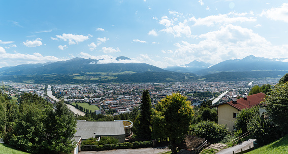 Panoramic high angle view of Innsbruck against mountains. Sunny day