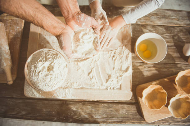istock Family preparing ingredients for kneading 956282152