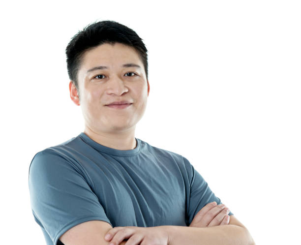 istock Young asian man with arms crossed 956284918