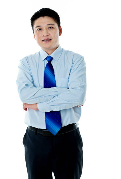 istock Asian businessman standing against white background 956285572