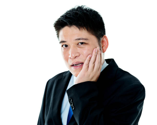 istock Young asian businessman suffering from toothache 956285986