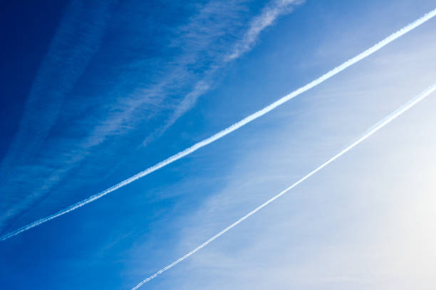 istock Trail of jet plane on blue sky. 956287116