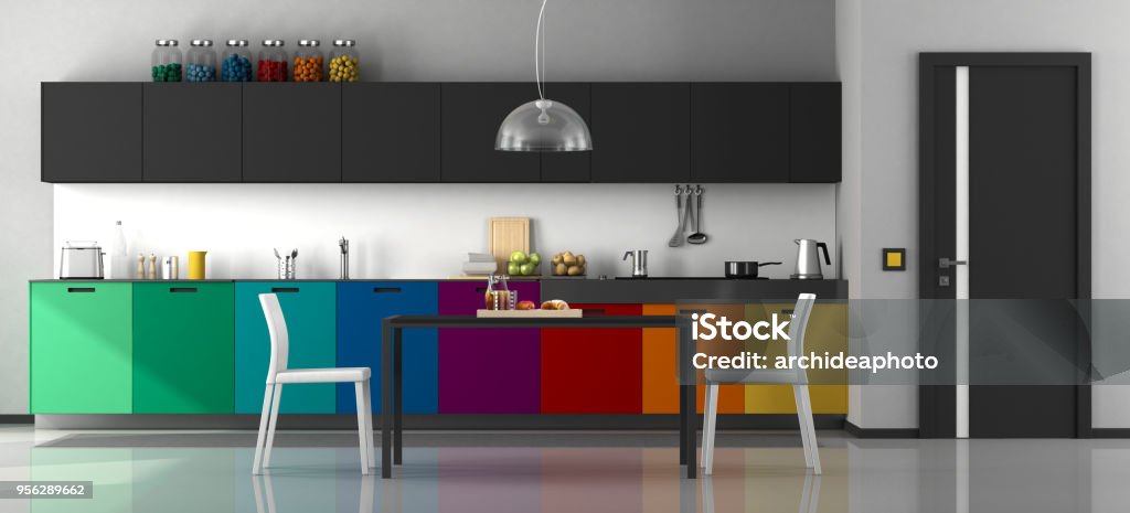 Colorful modern kitchen Colorful modern kitchen with dining table and chairs - 3d rendering
Note: the room does not exist in reality, Property model is not necessary Kitchen Stock Photo