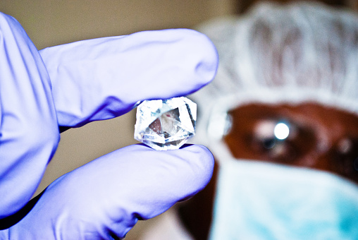 Diamond Specialist Inspect An Uncut Rock