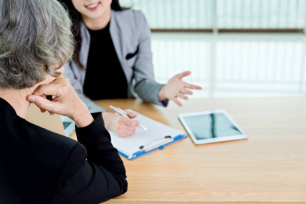 istock Two businesswomen working together in modern office 956291644