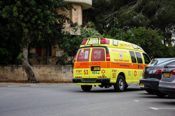 colors of Israel Jerusalem Israel May 04, 2018 View of a ambulance in the street of Jerusalem afternoon ambulance in israel stock pictures, royalty-free photos & images