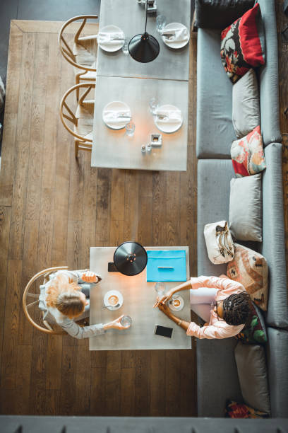 istock Two business women having coffee break in high-end restorant 956292264