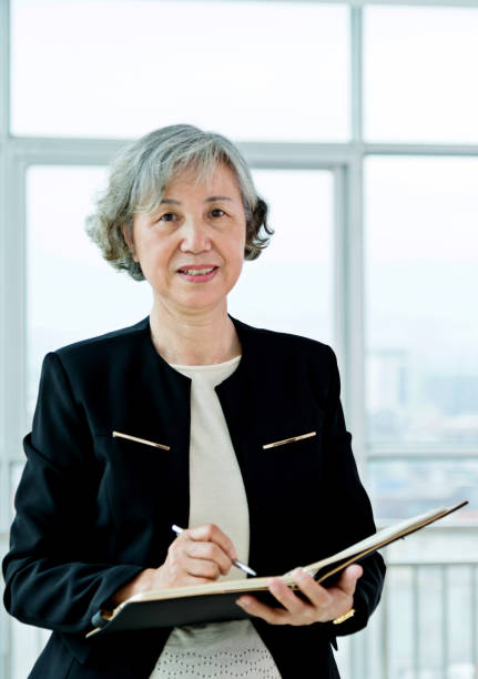 istock Senior businesswoman working in modern office 956292422
