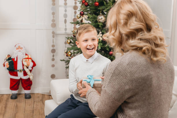 istock woman with son on christmas 956292656