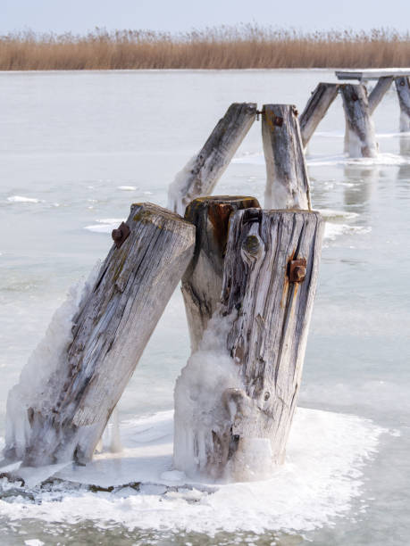 Ice on Lake Neusiedl Ice on Lake Neusiedl bollard pier water lake stock pictures, royalty-free photos & images