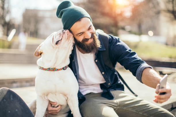 istock Man and dog in the park 956296156