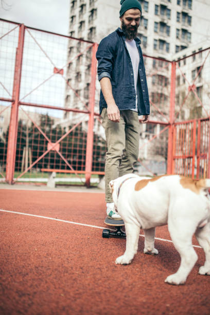 istock Man and dog in the park 956296406