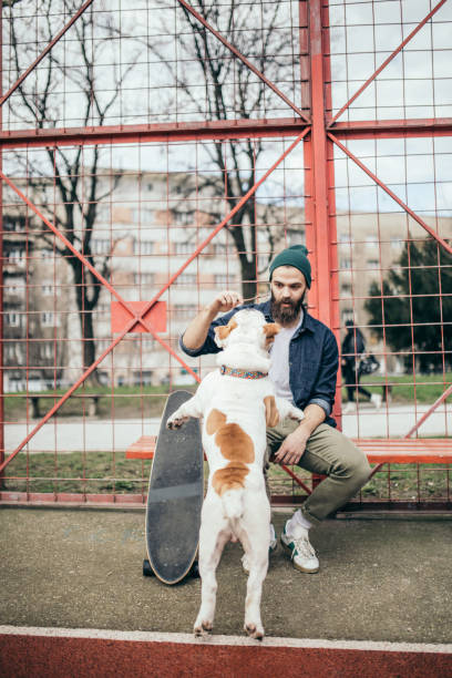 istock Man and dog in the park 956296560