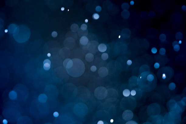 istock Christmas blur bokeh background texture abstract light glittering stars on bokeh. glitter vintage lights background 956297390