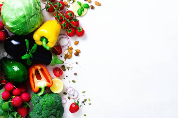 istock Set of fresh vegetables on a white background. Aromatic herbs, onion, avocado, broccoli, pepper bell, eggplant, cabbage, radish, cucumber, almonds, rucola, baby corn. Banner 956306514