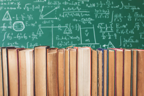 istock Books in front of green chalk board 956307266