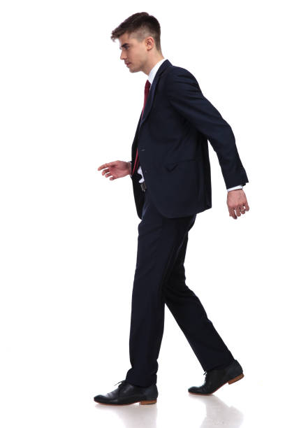 istock side view of businessman walking 956311618