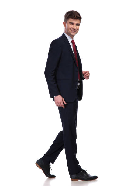 istock side view of laughing businessman walking 956312864