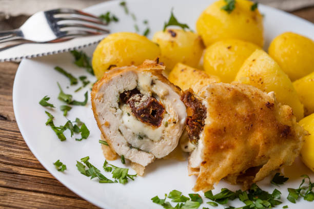 istock Chicken breast stuffed with cheese and dried tomatoes. 956316492
