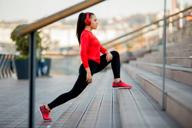 istock Young woman exercising outdoors 956316782