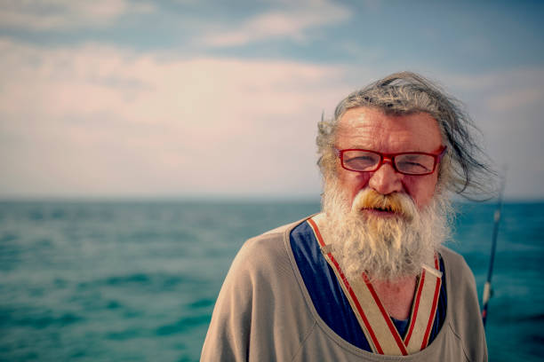 istock Old fisherman by the sea 956321126