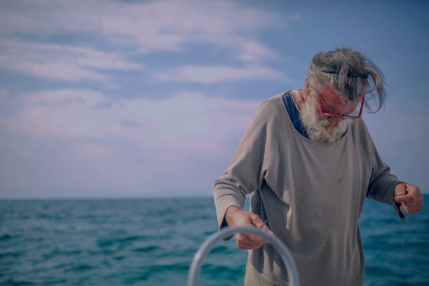 istock Old fisherman by the sea 956321130