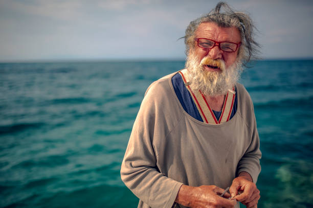 istock Old fisherman by the sea 956321358