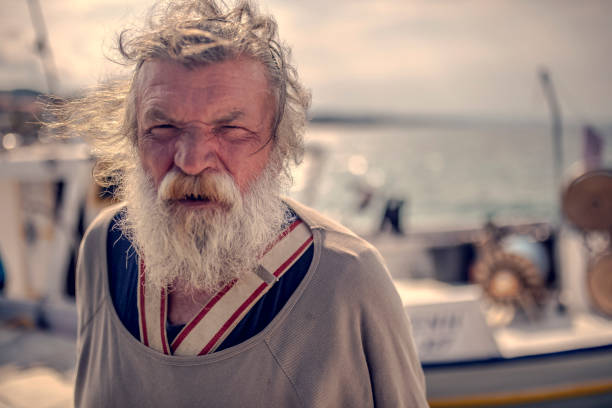 istock Old fisherman by the sea 956321630