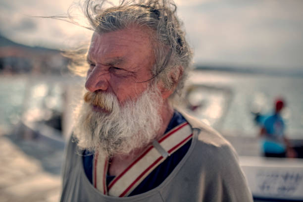 istock Old fisherman by the sea 956321674