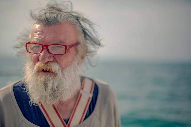 istock Old fisherman by the sea 956322062