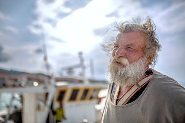 istock Old fisherman by the sea 956322254
