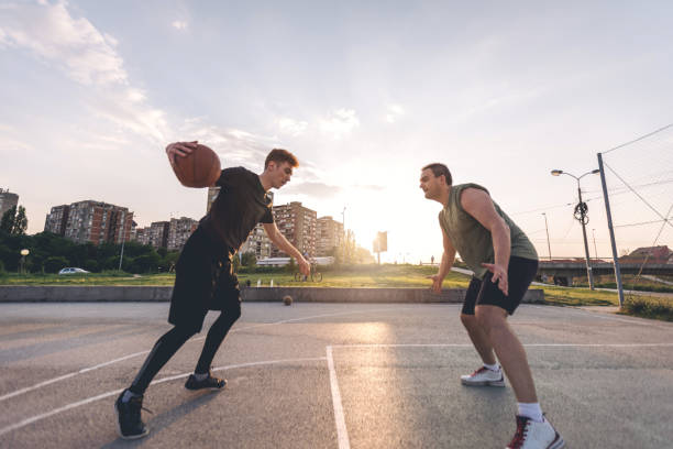 istock Playing basketball against a friend 956324852