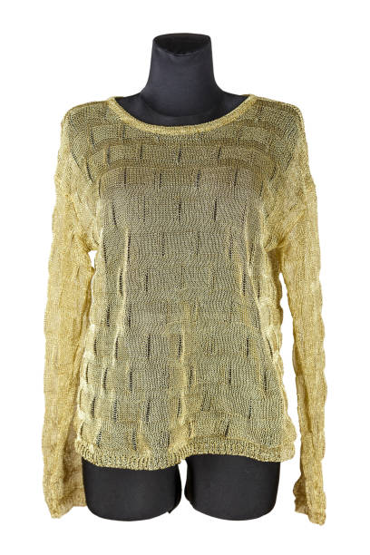 istock Women's knitted pullover of gold color, well visible weaving of thread. 956325878