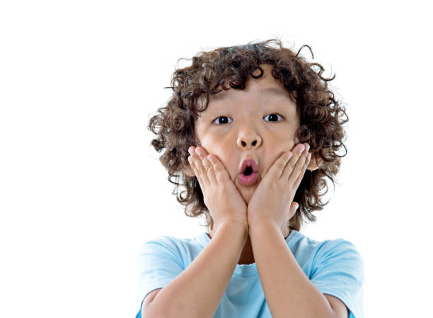 istock Boy surprised with hands on his mouth 956325902