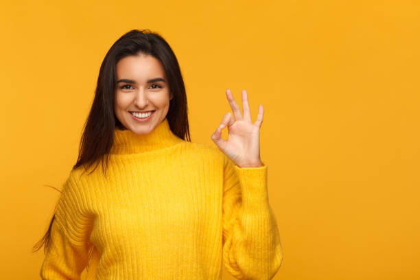 istock Charming girl showing OK gesture 956326006