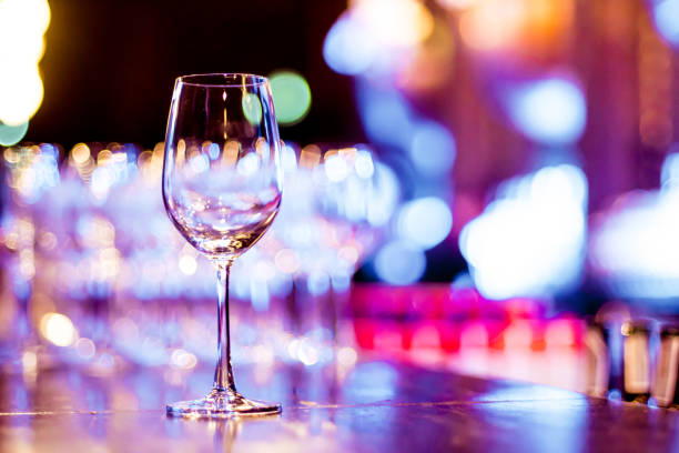 istock Wine Glass on Beautiful Night Background 956326874