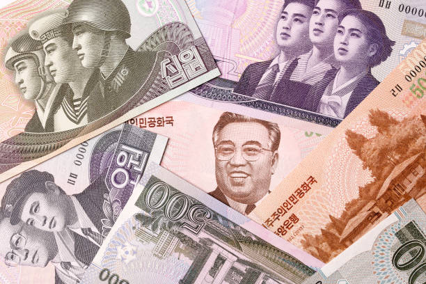 dinero de corea del norte, un fondo - korean currency fotografías e imágenes de stock