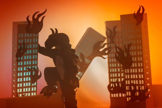 istock Terrible Dinosaur Boy Pushes Cardboard Building 956330952