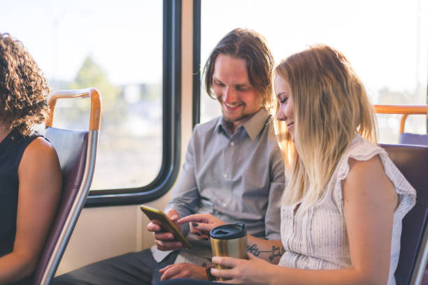 istock Millennial hipster couple ride public transit together 956336662