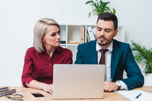 istock young business people working together and using laptop in office 956340344