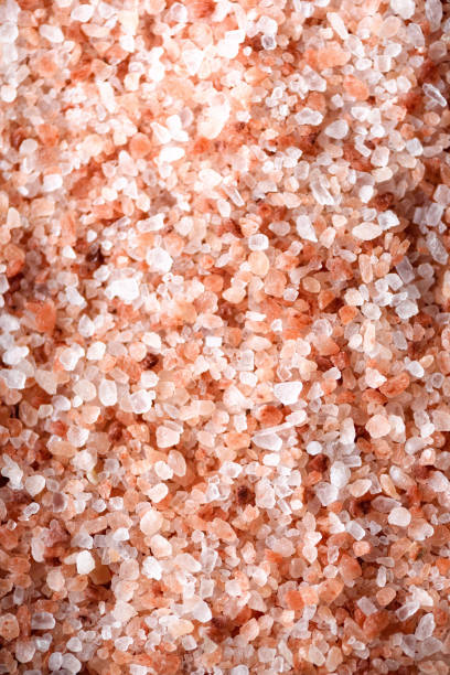 istock Pink himalayan salt background. Ingredients for cooking. Banner 956340898