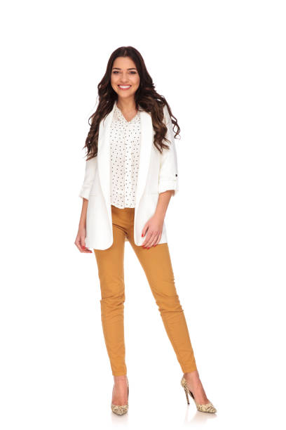 istock happy businesswoman standing on white background 956341776