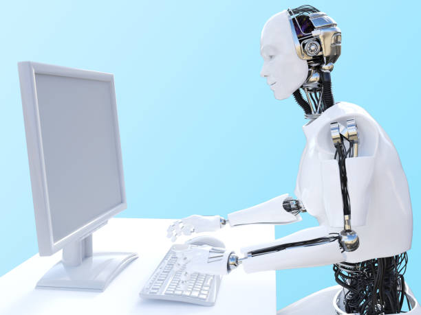 istock 3D rendering of male robot sitting at computer. 956344506
