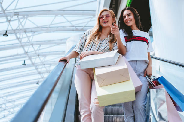 istock Girls at shopping center 956345016