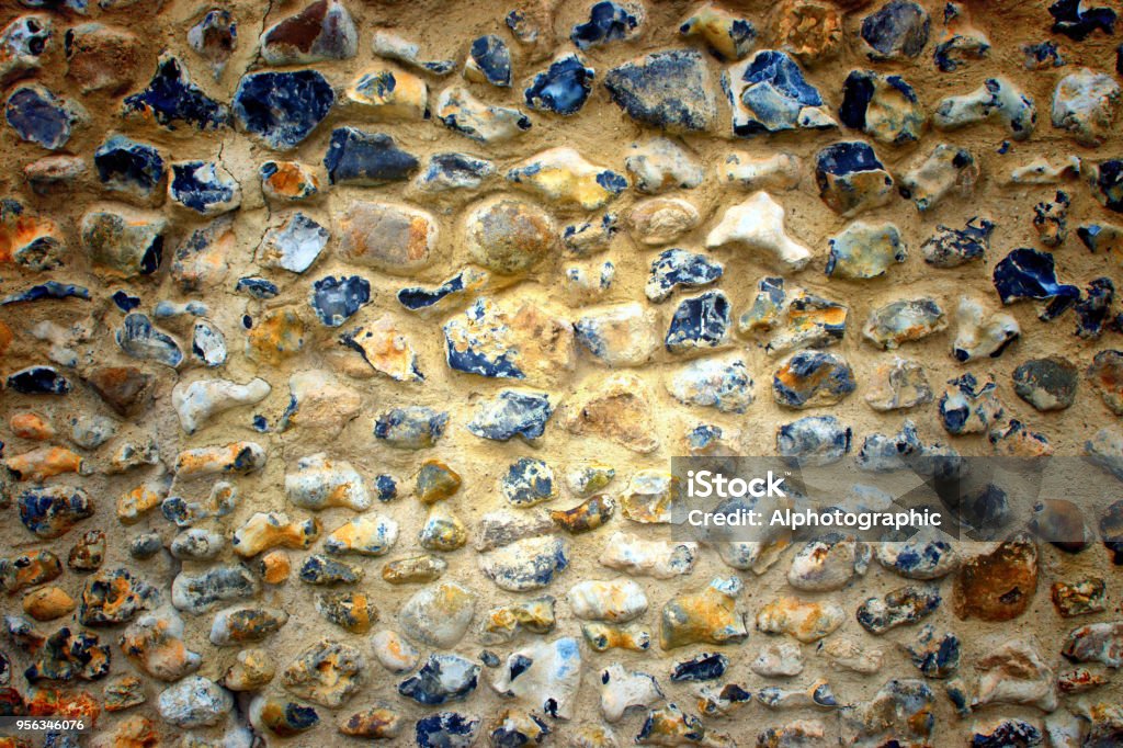 Flint wall textured background Flint wall textured background if an exterior wall in East Anglia Flint - Tool Stock Photo